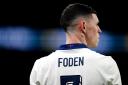 The St George's Cross graphic on the back of Phil Foden's shirt during England's friendly match against Brazil