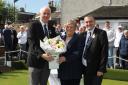 Vice president Jim McHarg presented April with flowers after she opened the green