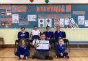 Delighted Kilcreggan Primary pupils with their award