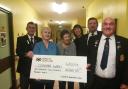Colgrain Bowling Club members hand over a cheque to staff from the Glenarn Ward at Dumbarton Joint Hospital