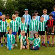 Coaches Caleb Alexander (far left) and Caelan Lang spent three days passing on their passion for cricket to their enthusiastic young campers