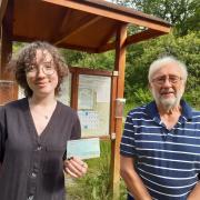 Daisey Harris receives a £50 cheque from chair of Duchess Woods, David Lewin