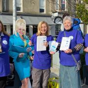 Dolly Parton - a big fan of books - helped volunteers hand out free books for World Book Day in Helensburgh