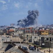 Smoke rises following an Israeli air strike in the central Gaza Strip.