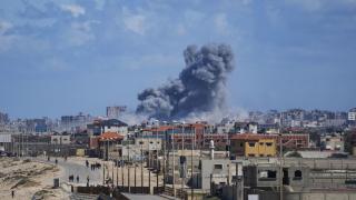 Smoke rises following an Israeli air strike in the central Gaza Strip.