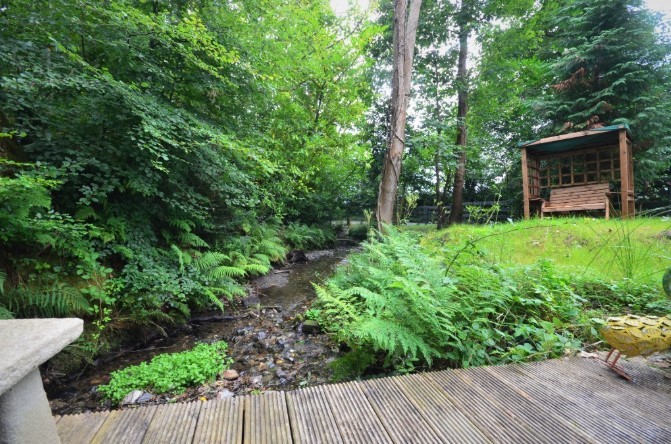 A stream runs through the garden, making it the perfect place to relax
