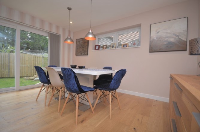 The ground floor boasts a feature lounge big enough for a large dining table overlooking the garden