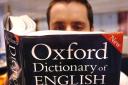 Embargoed to 0001 Thursday March 15  PICTURE POSED BY MODEL. A man reads a copy of the Oxford Dictionary of English..