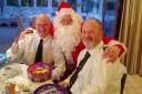Fundraisers Dave and Rab pose with Santa