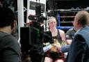 Hannah Rankin, seen here in a ringside TV interview after the successful defence of her WBA and IBO super-welterweight titles at the OVO Hydro in May, will put her two belts on the line against Terri Harper in Nottingham on September 24