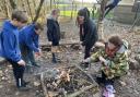 Pupils from one of the LEAF pilot schools toast marshmallows as part of their outdoor learning