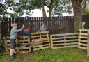 The pallets, pictured in August, helped pupils create adventures in the playground