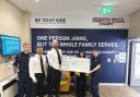 Royal Navy presenting reps of Endometriosis UK and The Submarine Family with joint cheque.