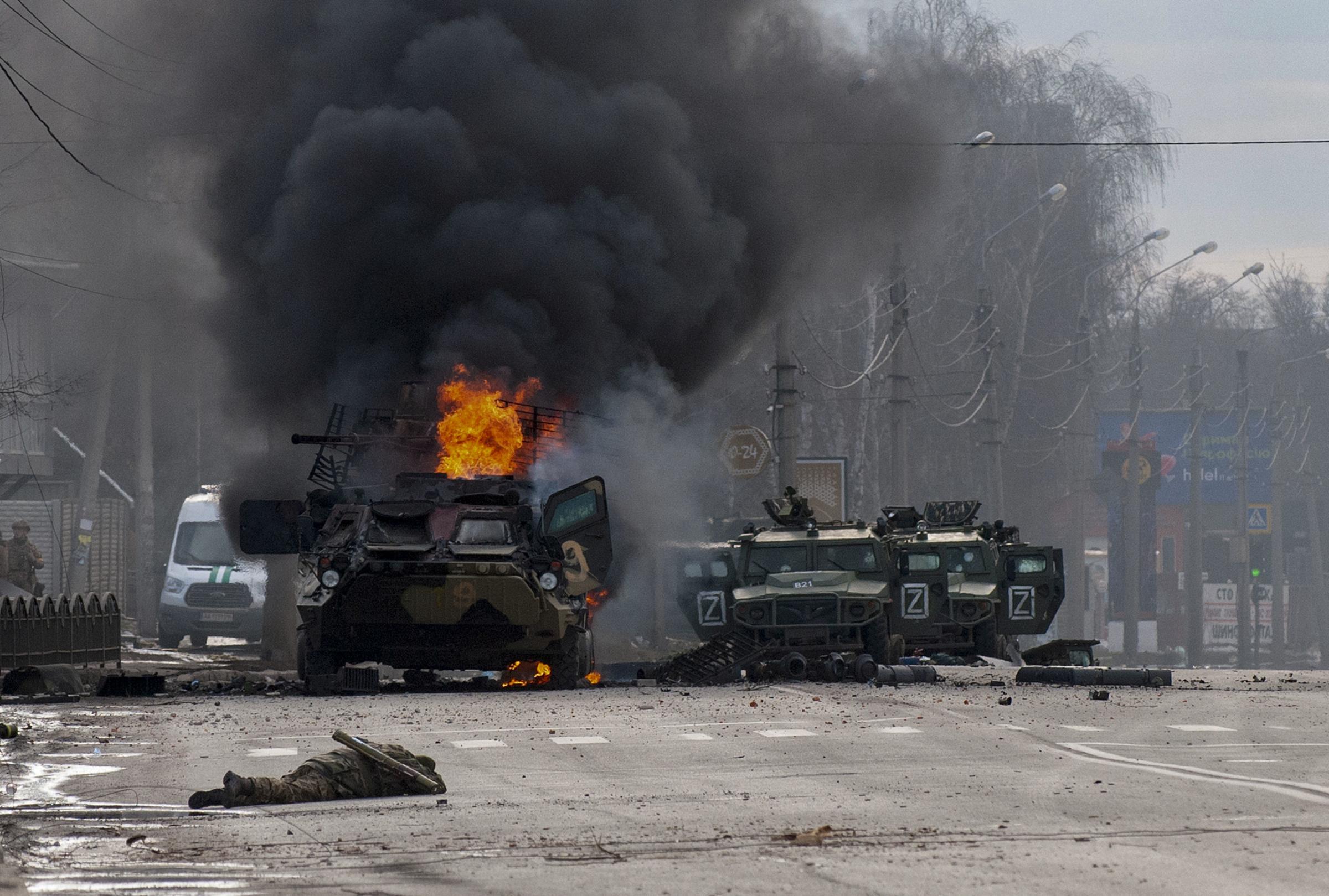 Burning and damaged army vehicles in the Ukraininan city of Kharkhiv (AP Photo/Marienko Andrew)