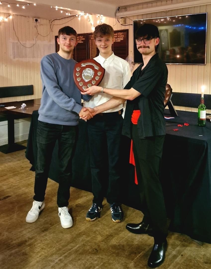 Second XI player of the year Daniel Dooley receiving the Brian Caulfield Shield, presented by Brians grandsons Jay and Leo
