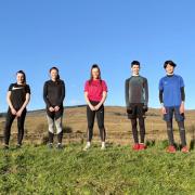 Some of the top young sprinters from Helensburgh AAC’s ranks pause during a socially-distanced training session before Christmas in the hills above the town