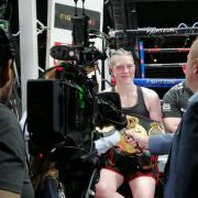 Hannah Rankin, seen here in a ringside TV interview after the successful defence of her WBA and IBO super-welterweight titles at the OVO Hydro in May, will put her two belts on the line against Terri Harper in Nottingham on September 24