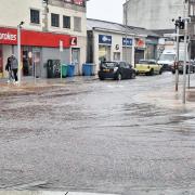Sinclair Street at the intersection with East and West Princes Street was under water early Saturday