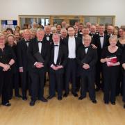 The choir pictured before a performance earlier this year