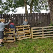 The pallets, pictured in August, helped pupils create adventures in the playground