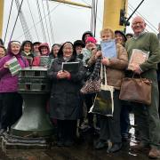 Members of both choirs met at the Tall Ship