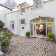 The former coach house is now a charming family home