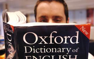 Embargoed to 0001 Thursday March 15  PICTURE POSED BY MODEL. A man reads a copy of the Oxford Dictionary of English..